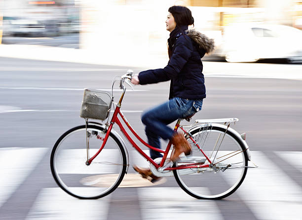 istock Japanese Woman Riding a Bicycle 154924996