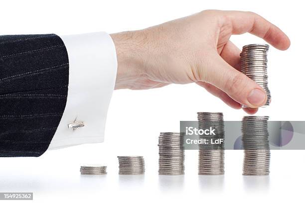 Hand Stacking Silver Coins Stock Photo - Download Image Now - Business, Chart, Coin