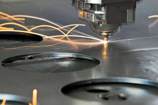 Laser metal cutting manufacturing tool in operation Laser metal cutting manufacturing tool in operation. machine stock pictures, royalty-free photos & images