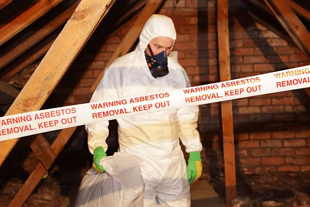 Photo of man removing asbestos