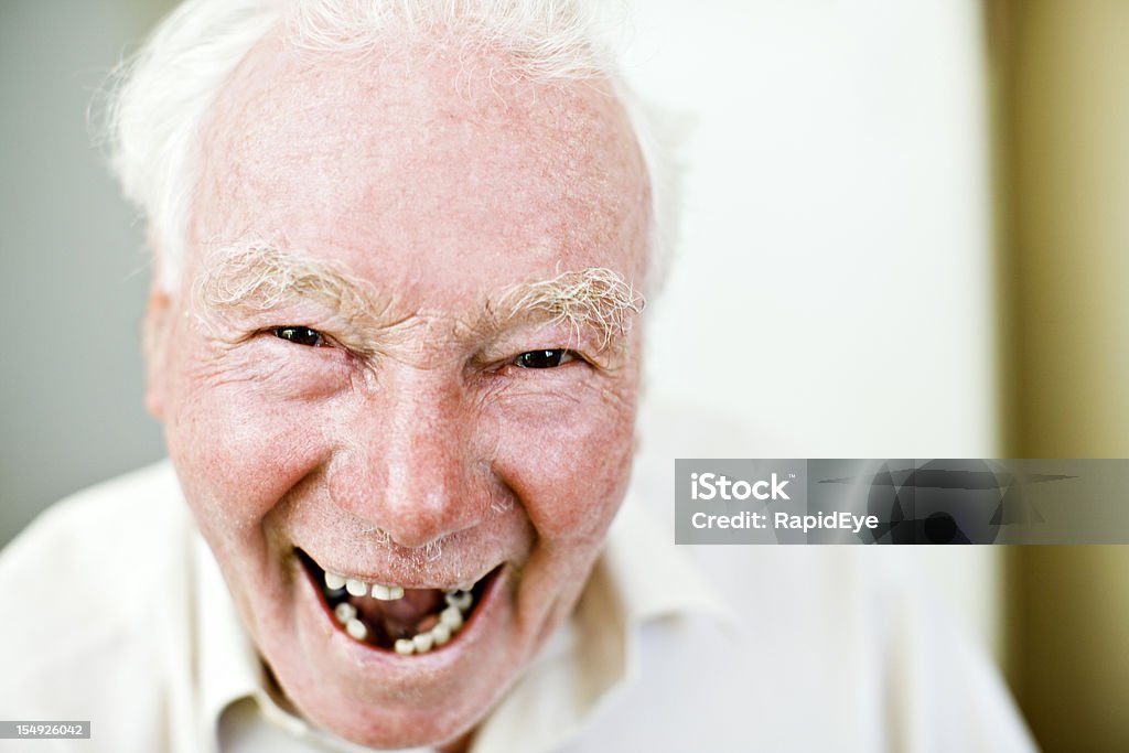 Old man with missing teeth smiles happily This old man might be missing some teeth but he is still smiling happily!  Gap Toothed Stock Photo