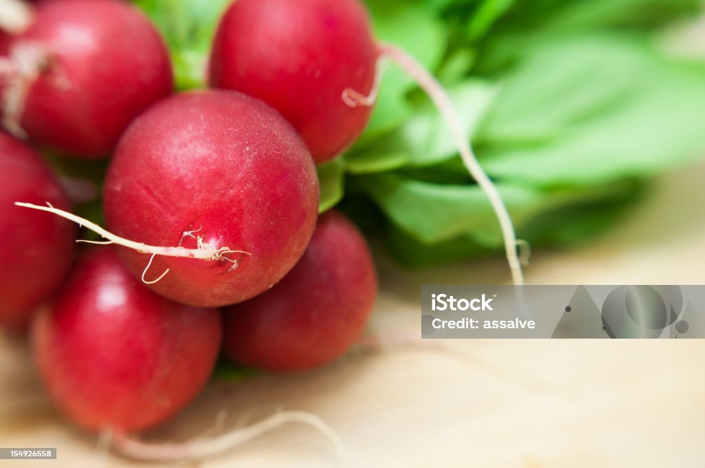 bunch of red radish on wood table shot with lensbaby + macro kit. i love it. very nice blurred effect. Backgrounds Stock Photo