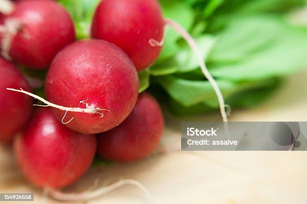 Bunch Of Red Radish On Wood Table Stock Photo - Download Image Now - Backgrounds, Blurred Motion, Bunch