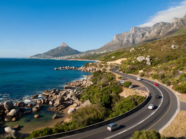 Garden Route - the road from Cape Town along the south African coast. Pictured here is the end of the garden route as it goes past the Twelve Apostles, Lions Head and towards Table Mountain. South Africa