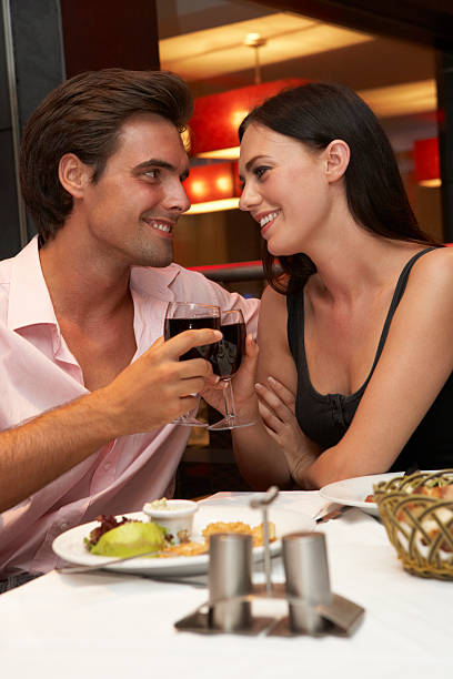 istock Young Couple Enjoying Meal In Restaurant 154926704