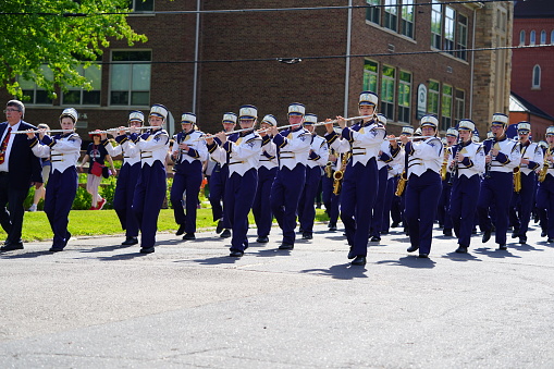 Marshfield, Wisconsin USA - May 29th, 2023: Marching band students of Columbus Catholic High School participate in the Memorial Day parade.