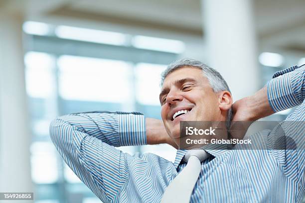 Business Man Relaxing In The Office Stock Photo - Download Image Now - Happiness, Mature Men, Achievement