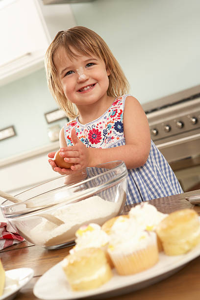 istock Young Girl Baking Cakes In Kitchen 154927002