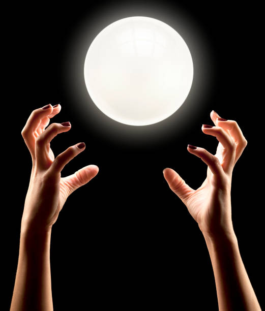 istock Fortune Teller's Hands Conjuring With Floating Crystal Ball 154927006