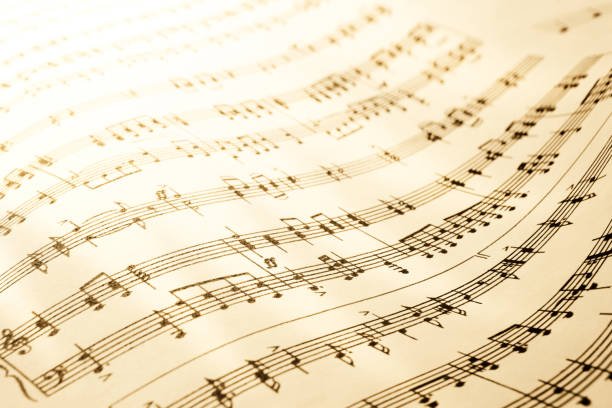 Close-up shot of sheet music in sepia tone.