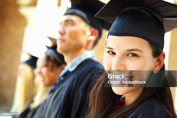 Primer Plano De Mujer Feliz De Posgrado Foto de stock y más banco de imágenes de Certificado - Certificado, Estudiante, Mirar por encima del hombro