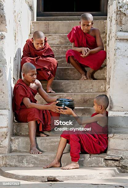 Young Monks Sitting On A Stairway Stock Photo - Download Image Now - Yangon, Alms, Bagan