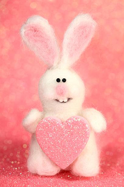 Honeysuckle colored Bunny with heart stock photo