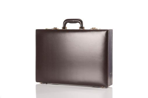 Leather retro briefcase, shot on a white background.