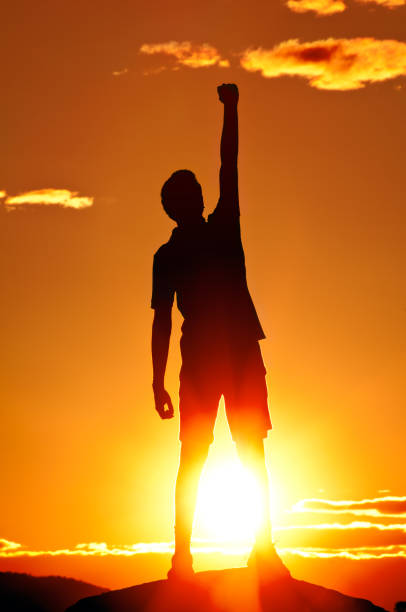 istock Young man is punching air in celebration, sunset scenery (I) 154930711