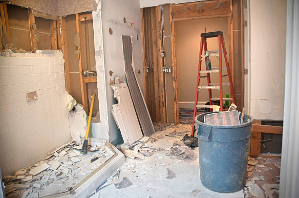 Master Bathroom Remodeling: Demolition Phase Master Bathroom Remodeling: Demolition Phase. The Master Bathroom is being demolished to the stud walls / subfloor level. Tiles are being taken down and wallpapers are being removed. demolished stock pictures, royalty-free photos & images