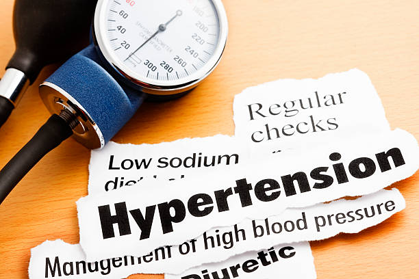 istock Blood pressure meter with headlines about hypertension 154930864