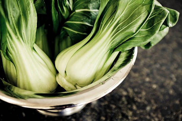 Bok Choy Fresh bok choy (chinese cabbage) in a collander. Bok Choy stock pictures, royalty-free photos & images