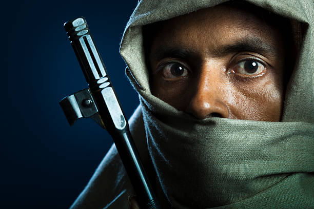 Captured in the portrait is the intense focus of a SWAT agent as they aim an assault rifle with determination
