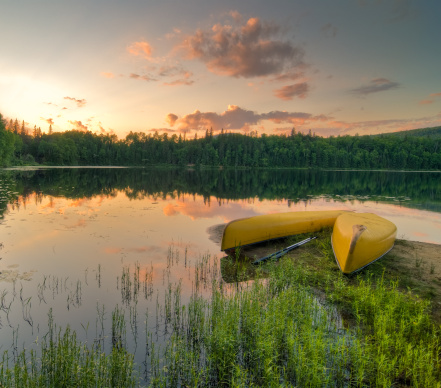 High dynamic range photo of canoes at sunset