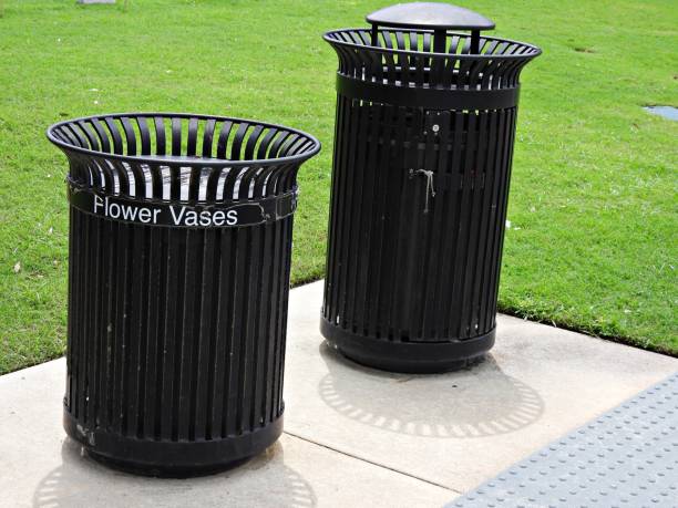 istock Trash receptacles installed on a cemetery to discard flower vases and trash 1549315628