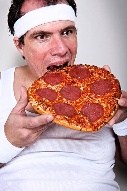 istock Overweight Man Eating After a Workout 154931621