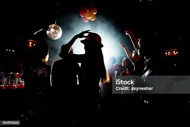 Shadow Of Young People Who Are Dancing In Night Club Stock Photo - Download Image Now