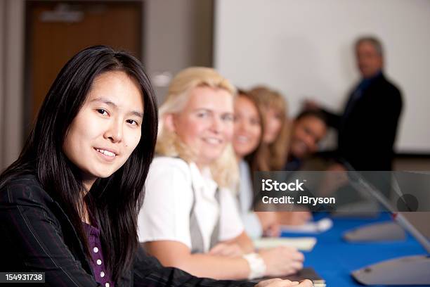 Real People Business Meeting Presentation With Businessmen And Businesswomen Stock Photo - Download Image Now