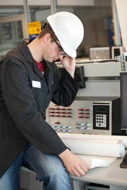 istock Industrial Worker With Plans and Phone 154931746