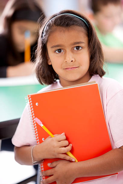 istock Diversity:  Mixed Race Girl Studying in School Learning Education 154931933