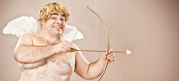 istock fat blonde cupid with bow and arrow aim for love 154932047