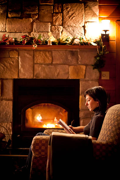 istock Reading in front of the fireplace 154932243