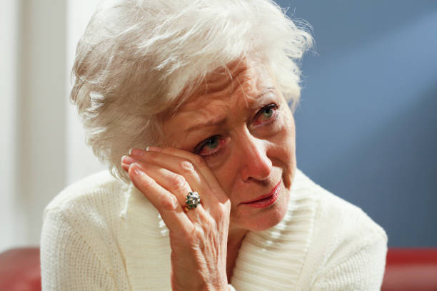 istock senior woman crying 154932368