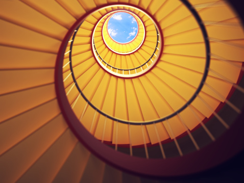 Low angle shot of a spiral staircase. 