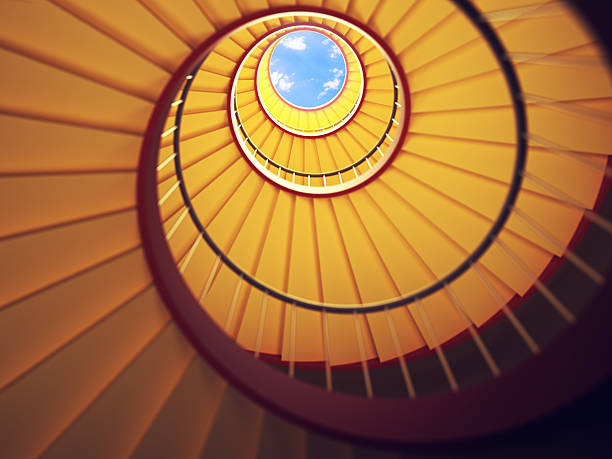 Under the Stairs Low angle shot of a spiral staircase.  directly below stock pictures, royalty-free photos & images
