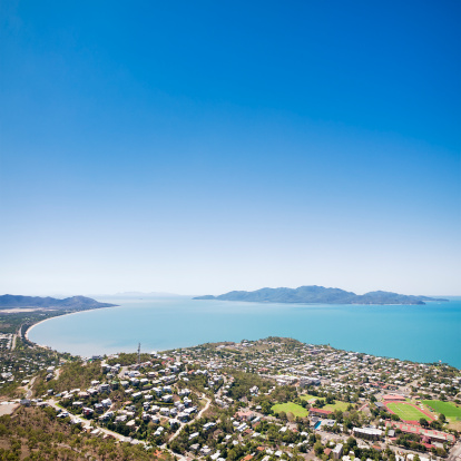 View towards Magnetic Island over a residential part of the city of Townsville in Queensland, Australia.