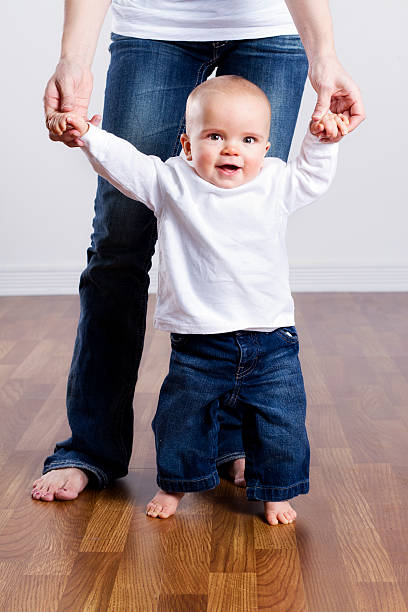 istock Mother Walking Her Baby Boy 154933293