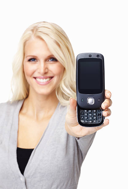 istock Young saleswoman displaying a cell phone - white background 154933344