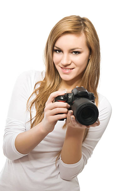 istock Young female photographer with DSLR on white 154933381