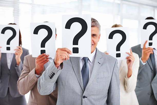 istock Business people covering their faces with question mark 154933615