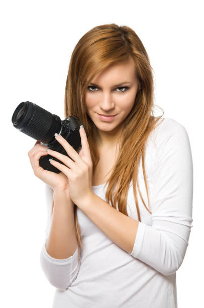istock Young female photographer with DSLR on white 154933832