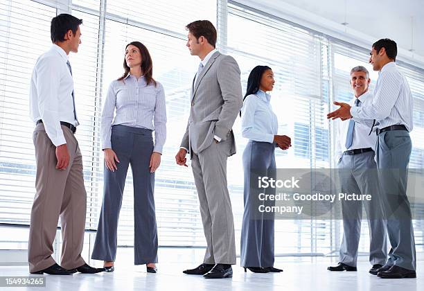 Business Professionals Stand In Office Setting Stock Photo - Download Image Now - Administrator, Adult, Adults Only