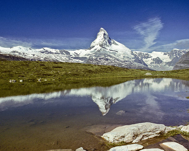 The Matterhorn Reflected in Leisee The Matterhorn (14,692') in the Pennine Alps on the border between Switzerland and Italy is probably one of the most recognizable mountains in the world. This reflection of the Matterhorn was taken from Leisee above the town of Zermatt in Valais Canton in Switzerland. jeff goulden switzerland stock pictures, royalty-free photos & images