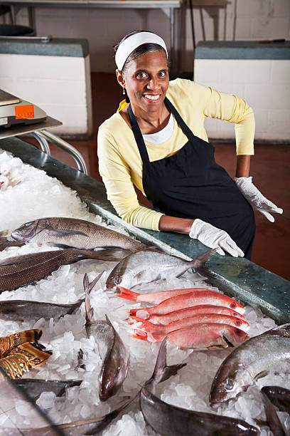 istock Worker in fish market with display of fresh catch 154934906