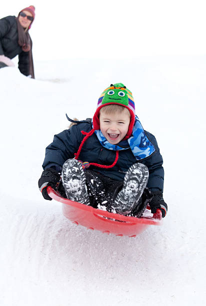 istock Young Caucasian Boy Winter Sliding 154935104