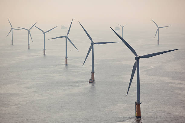 Wind turbines at sea  floating electric generator stock pictures, royalty-free photos & images