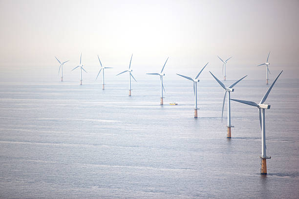 Line of wind turbines  floating electric generator stock pictures, royalty-free photos & images
