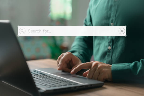 istock User working with a laptop computer on the table. Search engine optimization of the internet with the search bar. Best SEO technology networking, Searching browsing internet data information concept. 1549379445