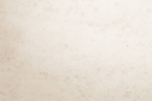 istock Colour old concrete wall texture background. Close Up retro plain cream color cement wall background texture. Design paper vintage parchment element show or advertise or promote product on display. 1549412580