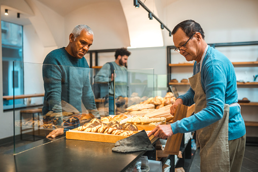 Mature Hispanic Male Buying Freshly Baked Goods In Small Artisan Bakery mexico-city-mexican-hispanic-latin-latino-ethnic-hispanic-latin-latino